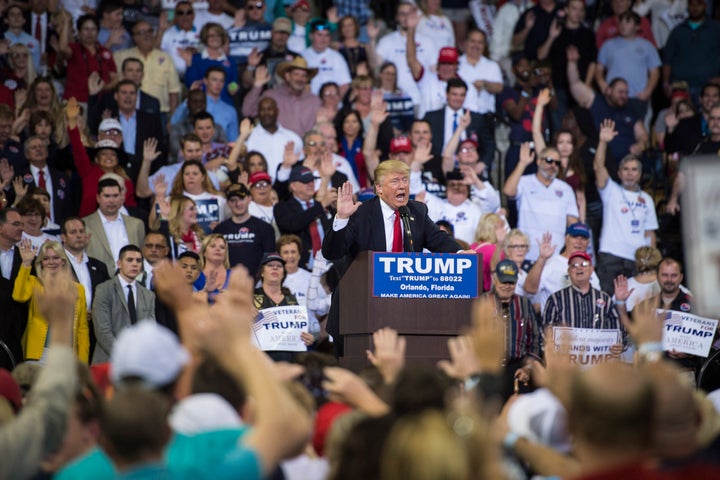 Trump asks everyone in the audience to pledge their vote to him as he speaks in Orlando, Florida, March 5, 2016.