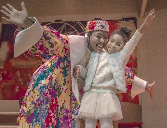 Dunasha Payne (left), cast as Glinda, the Good Witch of the South in Bedford Hills' production of "The Wiz," visits her young daughter after the show.