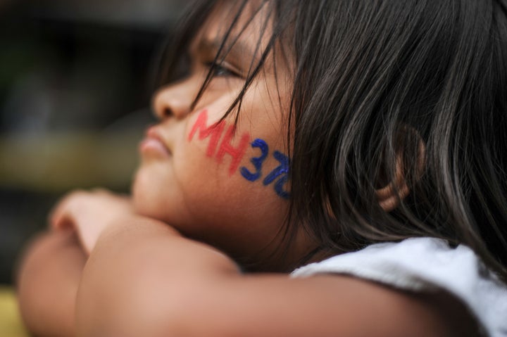 A child attends a remembrance ceremony for flight MH370 in Kuala Lumpur, Malaysia, this week.