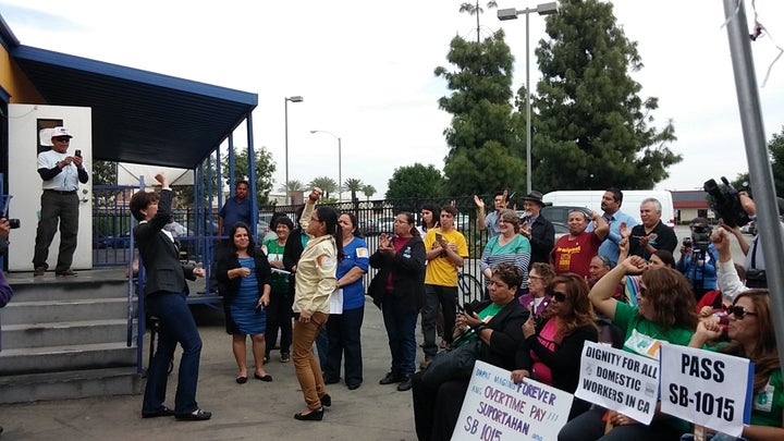 Teresita Villasenor at SB 1015 campaign launch in Pomona on March 4, 2016. She is facing bill author Senator Connie Leyva, as they chant "Si Se Puede!"