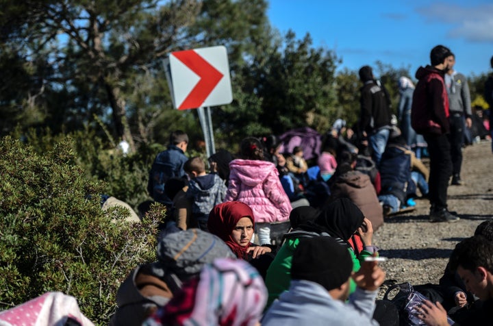 There was no letup in the number arrivals to Greece's outlying islands, either. Migrants and refugees try to reach the Greek island of Lesbos from Dikili, western Turkey.