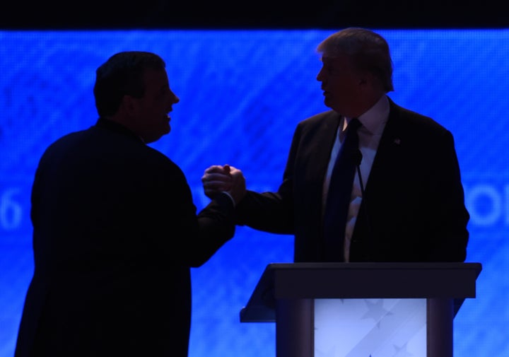 Business magnate Donald Trump, right, and New Jersey Gov. Chris Christie (R), left, shake hands in February during a break in a Republican presidential debate.