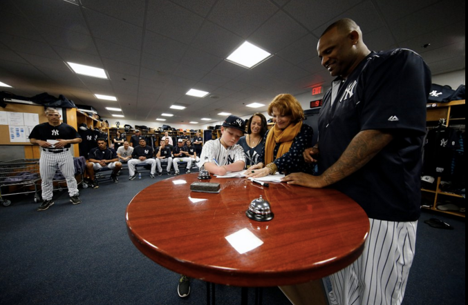 The fourth grader signed a one-day contract with the Yankees, an event that was overseen by his family and pitcher CC Sabathia.