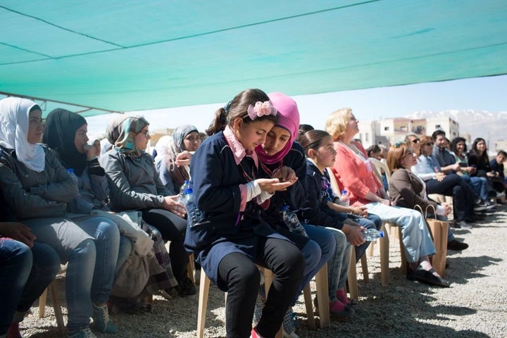 Students at the Malala School inspect medals they have won during the celebrations on March 7, 2016.