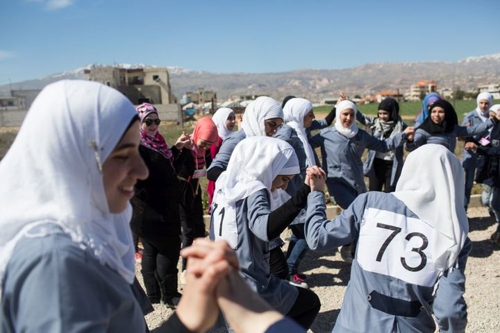 To mark International Women's Day, students take part in a traditional dance at the Malala School in Bar Elias on March 7, 2016.
