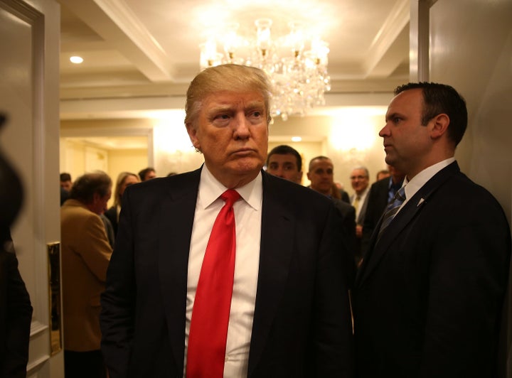 Donald Trump arrives at his Tuesday night press conference at the Trump National Golf Club in Jupiter, Florida, where the attack is alleged to have taken place.