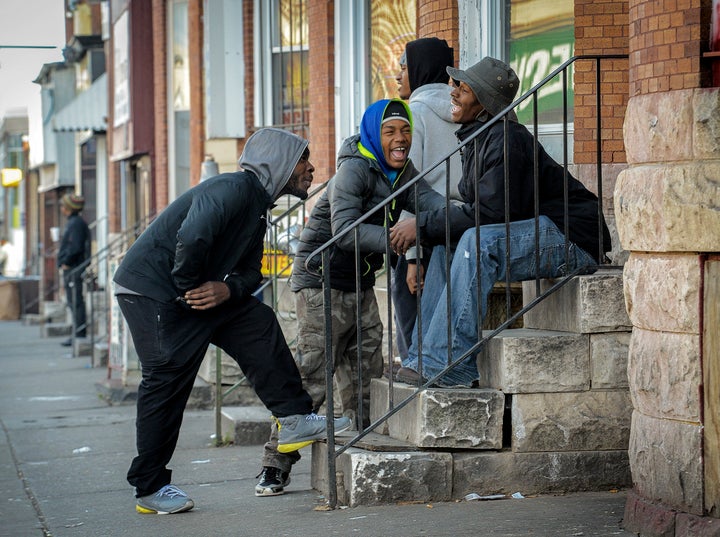 Young men share a laugh on Dec. 3, 2015, near the unofficial ground zero of the Baltimore riots.