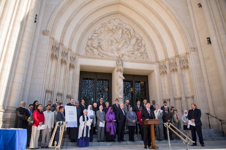 Religious leaders gather to sign Shoulder to Shoulder's anti-bigotry religious freedom pledge at the Washington National Cathedral.