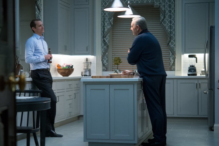 Frank Underwood and Will Conway quarrel in the kitchen.