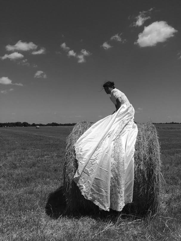 Herrera on a bale of hay.