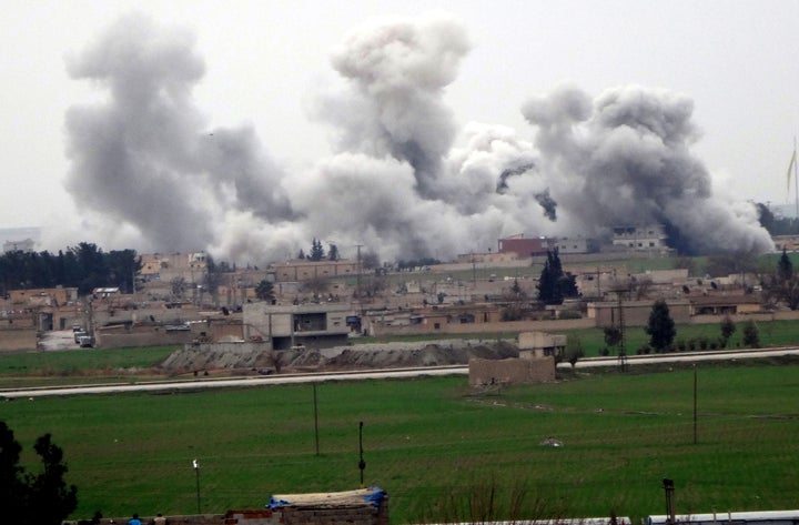 Western leaders say the Islamic State group now poses a greater danger to the West than al Qaeda. Smoke rises from Tel Abyad, Syria, during clashes between Islamic State militants and the Kurdish People's Protection Units.