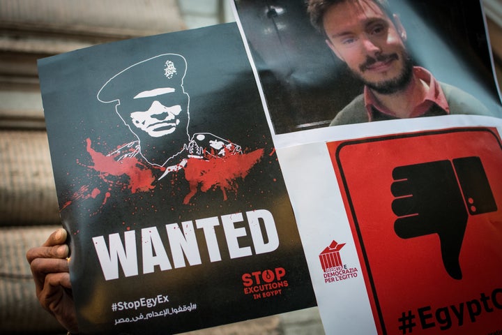 Protesters hold signs portraying Egyptian President Abdel Fattah el-Sisi at a Feb. 13 protest in Rome demanding jus