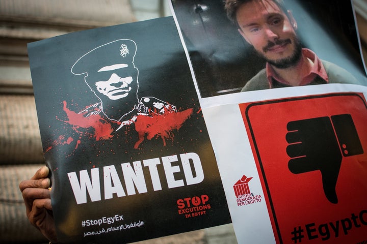 Protesters hold signs portraying Egyptian President Abdel Fattah el-Sisi at a Feb. 13 protest in Rome demanding justice for slain Italian researcher Giulio Regeni.