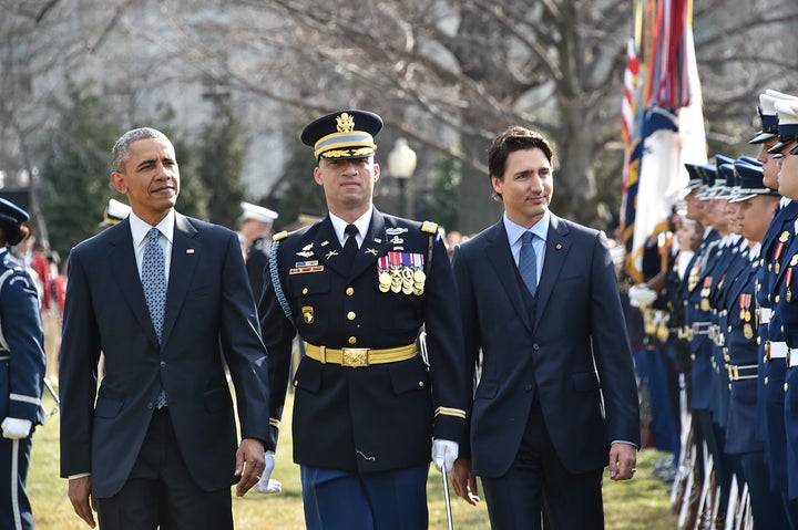 US President Barack Obama and Canada's Prime Minister Justin Trudeau take part in a welcome ceremony during a State Visit on the South Lawn of the White House on March 10, 2016 in Washington, D.C.