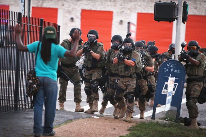 Police in Ferguson, Missouri, responded with tear gas and rubber bullets as residents protested the fatal police shooting of unarmed black teenager Michael Brown on Aug. 9, 2014.