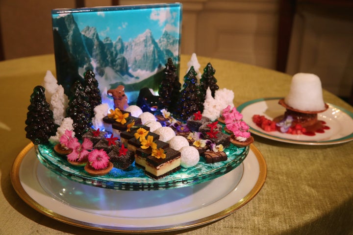 A display of bite-size sweets uses a photograph of the Rocky Mountains as a backdrop for the state dinner honoring Canadian Prime Minister Justin Trudeau in the State Dining Room at the White House March 9, 2016, in Washington, D.C. The White House chose the colors, flowers and menu with "an ambiance that reflects the scenic beauty of our shared border and celebrates the coming of spring." The son of former Prime Minister Pierre Trudeau and the leader of Canada's Liberal Party, Trudeau is visiting Washington this week for the first state dinner for a Canadian leader in almost 20 years. 