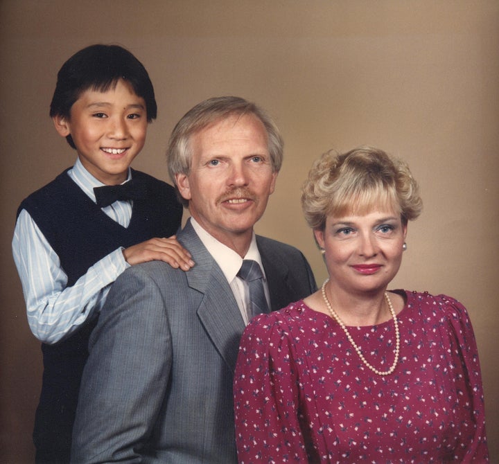 Anders as a child with his adoptive parents.