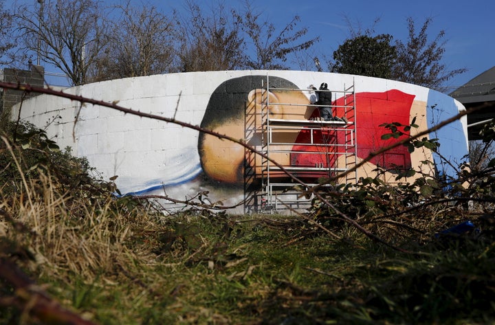 The mural will greet commuters at the side of the river Main.