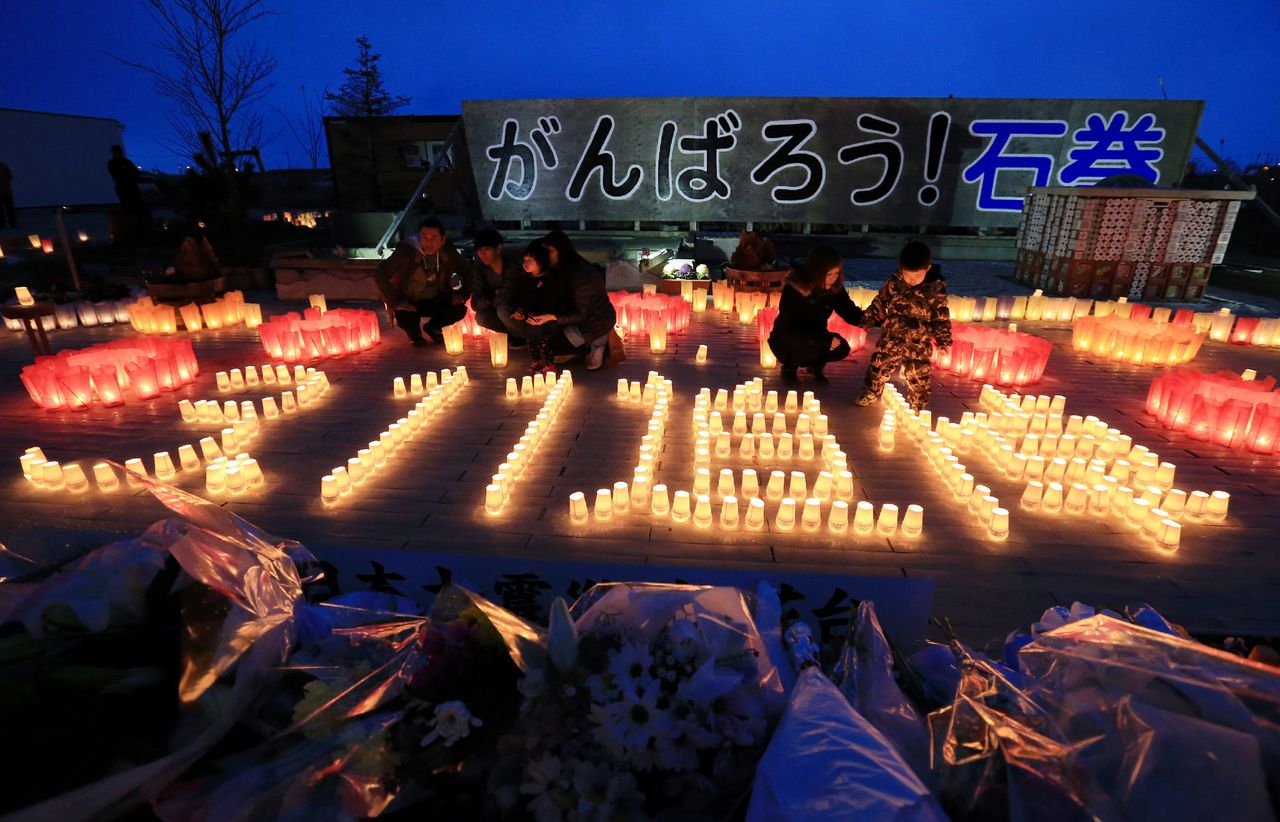 Candles spell out "3.11 memorial" in Japanese in Ishinomaki, a city in the Tohoku region.
