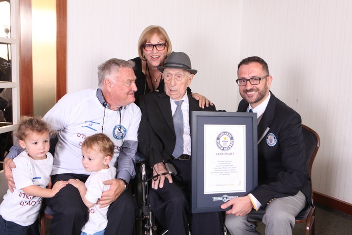 Marco Frigatti, Head of Records for Guinness World Records, presents Israel Kristal his certificate of achievement for Oldest living man on 11th March 2016, Haifa, Israel. From L-R: grandchildren Nevo and Omer, Heim Kristal (son), Shula Kuperstoch (daughter), Israel Kristal, Marco Frigatti