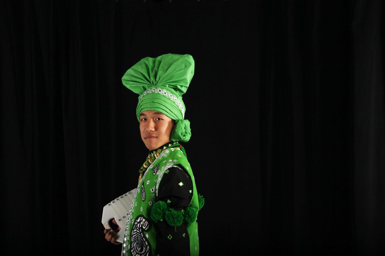 CU Bhangra dancer Benjamin Yi wears a traditional turban, called a "pagh<em>," </em>as part of his bhangra costume.