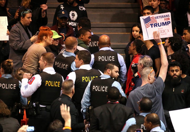 A demonstrator is removed by Chicago police during a rally for Republican presidential candidate Donald Trump at the UIC Pavilion in Chicago on Friday, March 11, 2016