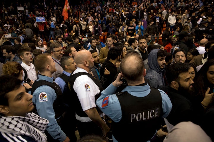 Anti-Trump protesters confront his supporters during a Trump rally at the UIC Pavilion in Chicago on March 11, 2016.