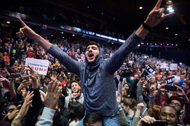 Protestors celebrate after an event was postponed where republican presidential candidate Donald Trump was to speak at the University of Illinois at Chicago Pavillon in Chicago, IL on Friday March 11, 2016.