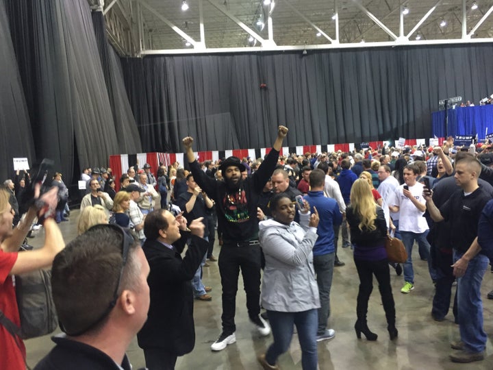 Anti-Trump protesters being escorted out by security in Cleveland