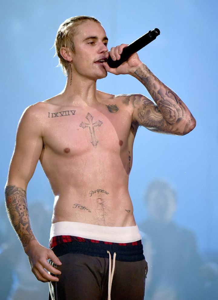 In solidarity with fans who bought the misspelled t-shirts, The Biebs has now given up wearing tops completely.