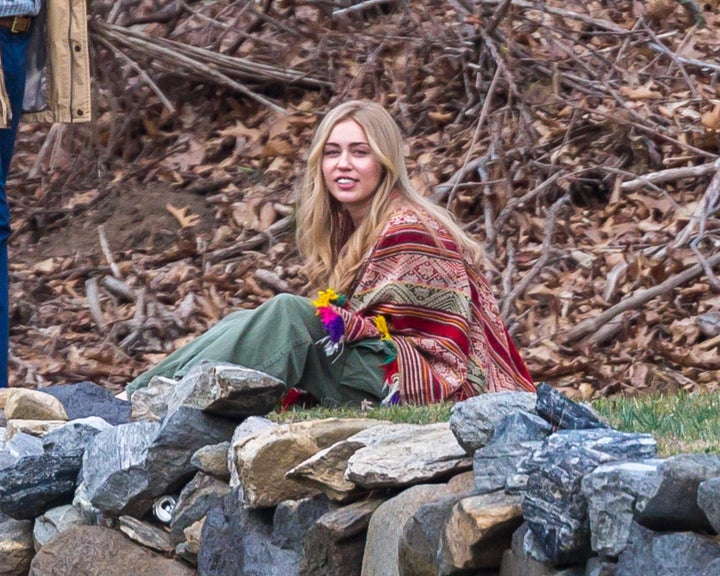 Miley Cyrus in long wig and hippie outfit seen filming Woody Allen's Amazon Project.