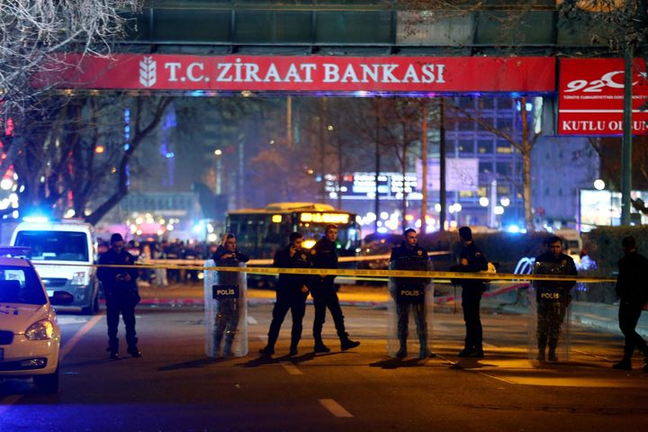 Policemen stand guard the streets after a blast in Ankara on March 13, 2016.