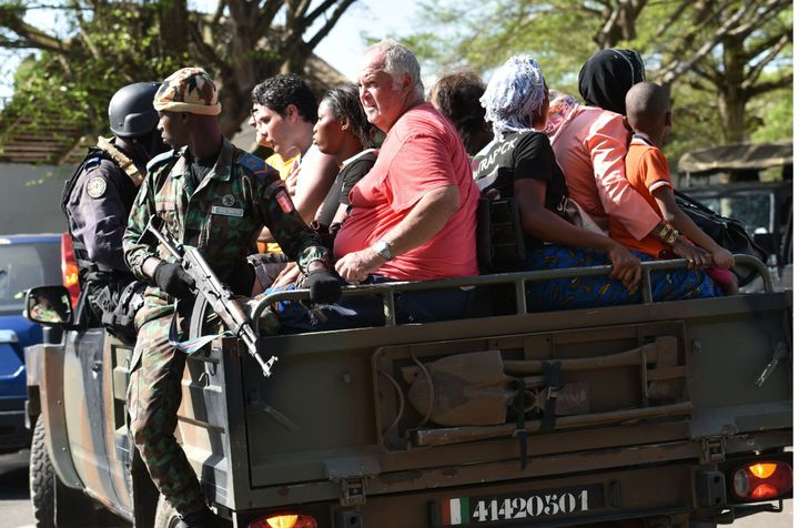 Ivorian security forces evacuate people after heavily armed gunmen opened fire on March 13, 2016.