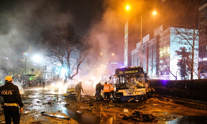 Emergency workers help victims after a car bomb attack in the Turkish capital of Ankara on March 13.