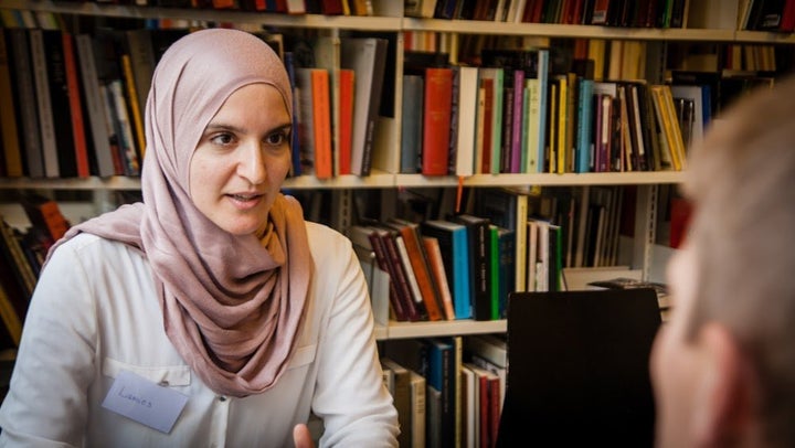 A woman tells her story at the Copenhagen Central Library.