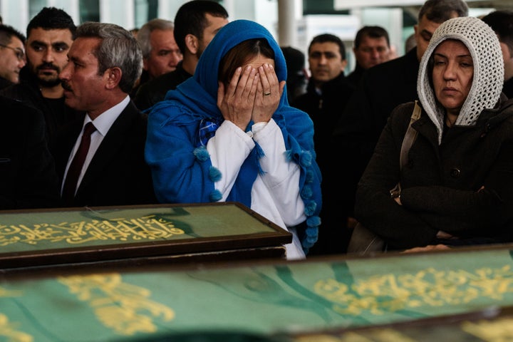 Women mourn near coffins during a funeral ceremony in an Ankara mosque on March 14 for the victims of a suicide car bomb that ripped through a busy square the day before. At least 37 people were killed and many more wounded. 