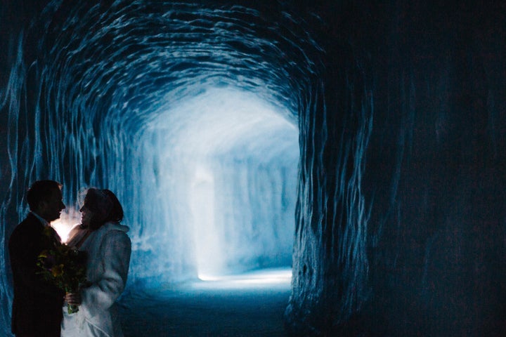 The bride and groom pose within the Langjökull Glacier in Iceland on March 3.