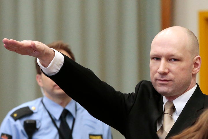 Anders Behring Breivik make a Nazi salute as he enters court in Norway today.