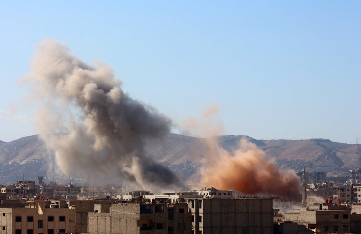 Smoke rises from residential areas after Russian airstrikes in Arbin, a town in the eastern Ghouta region. Russia conducted a
