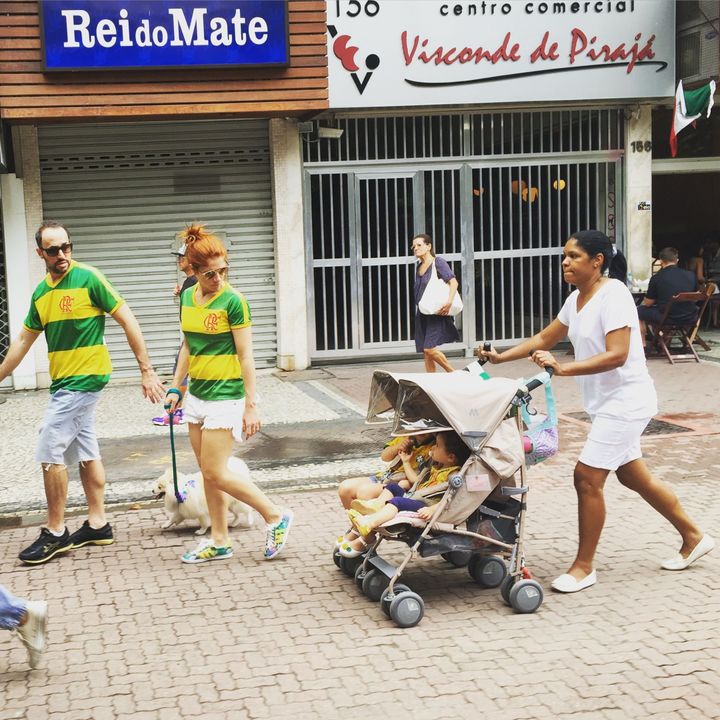 This photo of Claudio and Carolina Maia Pracownik marching in Brazil's recent anti-government protests, while their nanny, Maria Angélica Lima, trails behind with their children, has gone viral on social media.