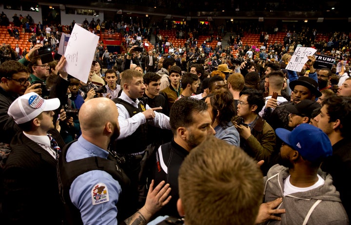 Protesters confront Trump supporters during a rally for the candidate in Chicago on March 11.