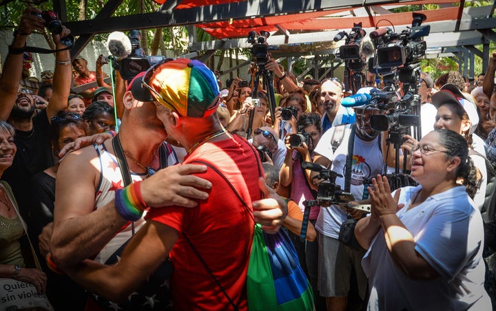 A couple performs a symbolic marriage during a gay parade in Cuba. 