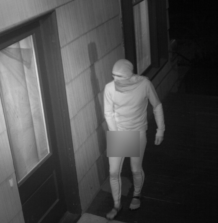 The masked masturbator has visited the home as many as four times, police say.