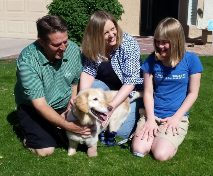 Chi Chi with her new family, Richard, Elizabeth and Megan Howell.