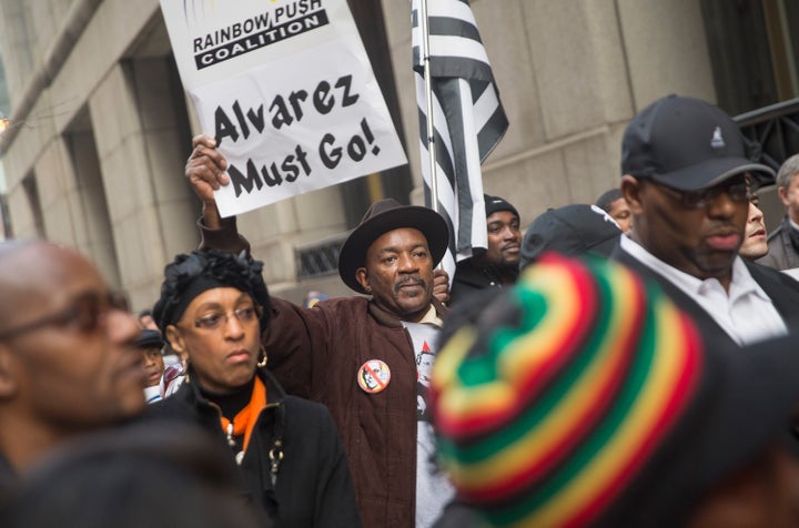 Demonstrators march around City Hall calling on Mayor Rahm Emanuel to resign on December 11, 2015 in Chicago, Illinois. A recently released video of the shooting of Laquan McDonald by Chicago Police officer Jason Van Dyke has sparked protests and calls for Mayor Rahm Emanuel and Cook County State's Attorney Anita Alvarez to resign for allegedly trying to cover up the circumstances surrounding the shooting.