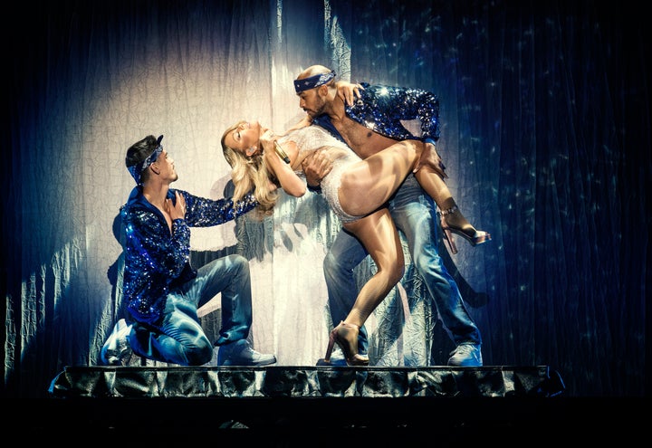 <strong>Mariah evidently blew the budget on sequins instead of shirts for her dancers</strong>