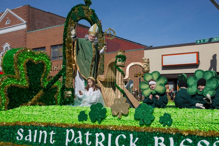 A man dressed as St. Patrick waves at the crowd during a parade in South Boston, Massachusetts.