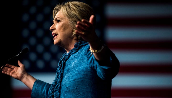 Former Secretary of State Hillary Clinton speaks to a cheering crowd at a victory party in West Palm Beach, Florida, March 15, 2016.