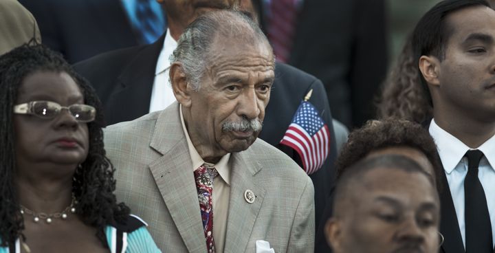 Rep John Conyers (D-MI), center, is one of 32 House Democrats introducing a bill to reform Michigan's Emergency Manager Law, which they say led to the Flint water crisis.
