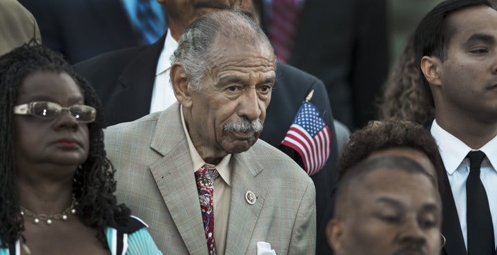 Rep John Conyers (D-MI), center, is one of 32 House Democrats introducing a bill to reform Michigan's Emergency Man